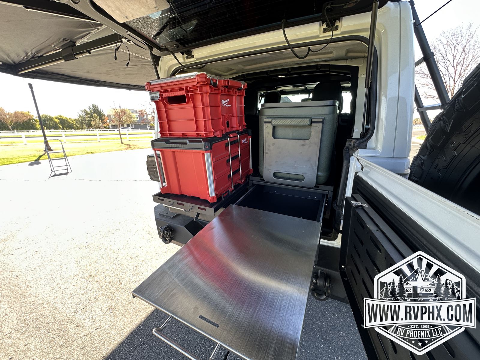 Stainless slide-out prep counter extending from the rear drawer system